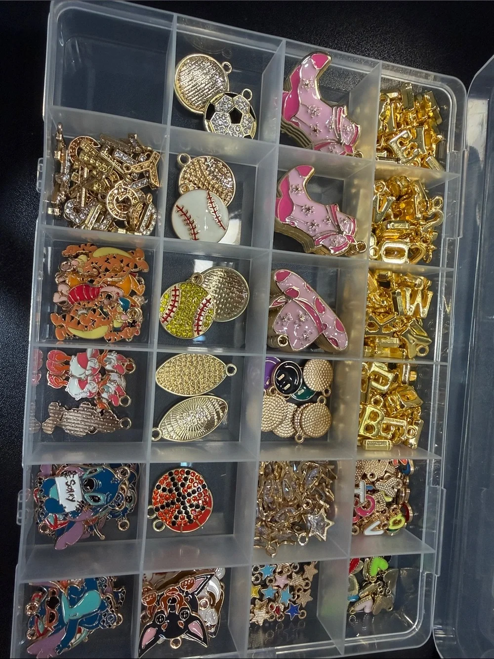 Charm necklace and bracelet making kit. Everything in the picture is included.